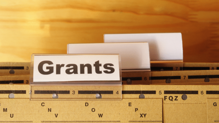 An image of a paper folder with a grants label