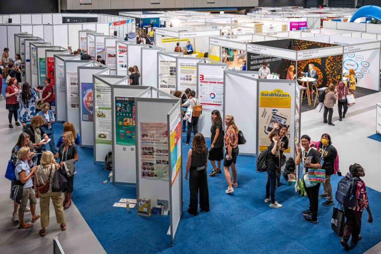 An image of people in a poster's exhibition